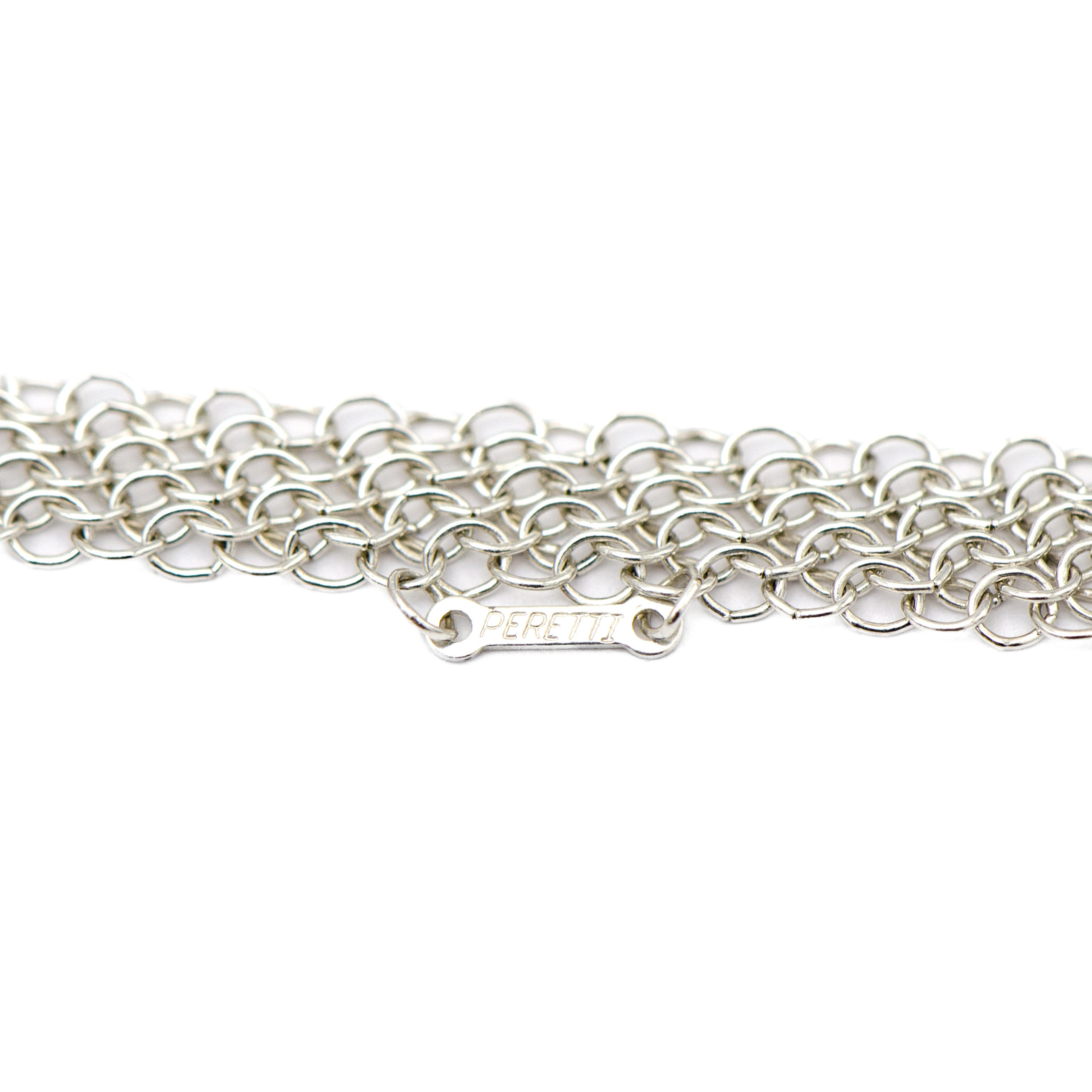 Elsa Peretti® Mesh bib necklace in 18k gold with a tumbled emerald bead. |  Tiffany & Co.