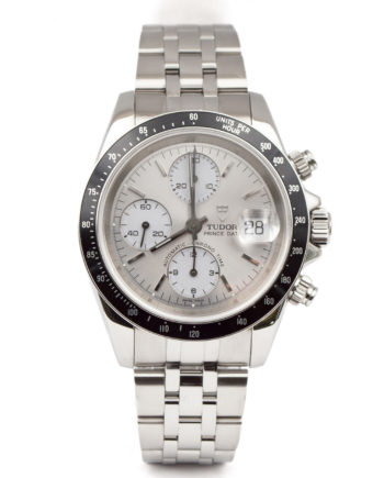 Tudor Prince Date Chrono Watch with silver dial, bracelet, and subdial. The watch has a black bezel with silvertone markers.